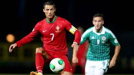 Ronaldo’s second-half hat-trick dashes Northern Ireland’s hopes of an upset at Windsor Park