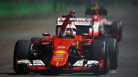 Sebastian Vettel wins in Singapore as intruder walks on to track