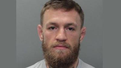 Conor McGregor pleads not guilty to charges over phone incident