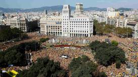 Thousands of Catalans crowd Barcelona to call for early elections
