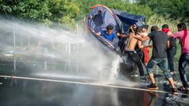 Hungarian police fire tear gas, water cannon at migrants