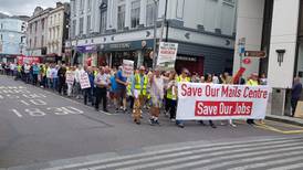 An Post workers protest in Cork as mail centre faces closure