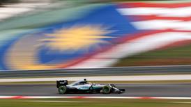 Lewis Hamilton takes pole in Malaysia